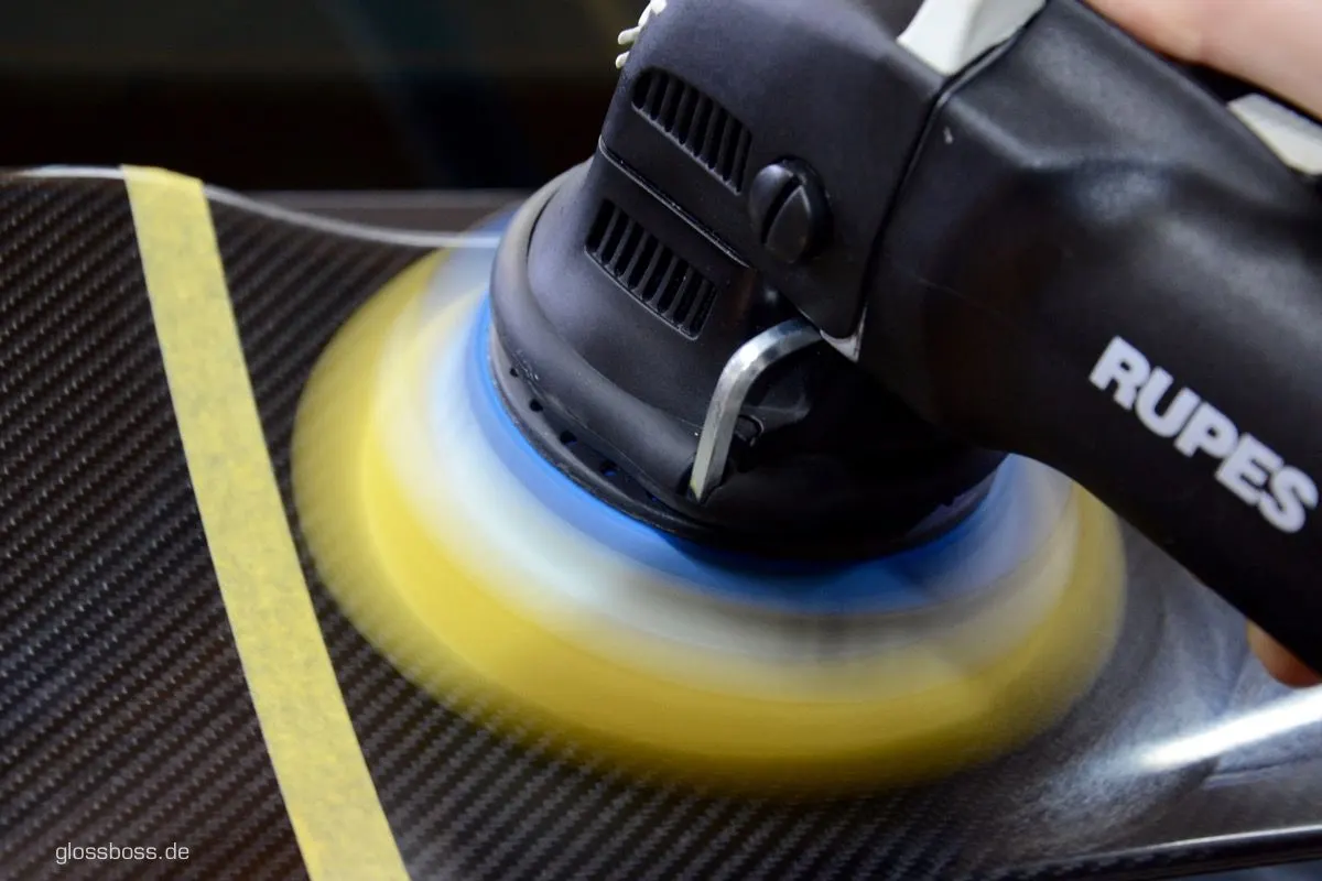 Dual-action polisher running on a carbon fiber panel